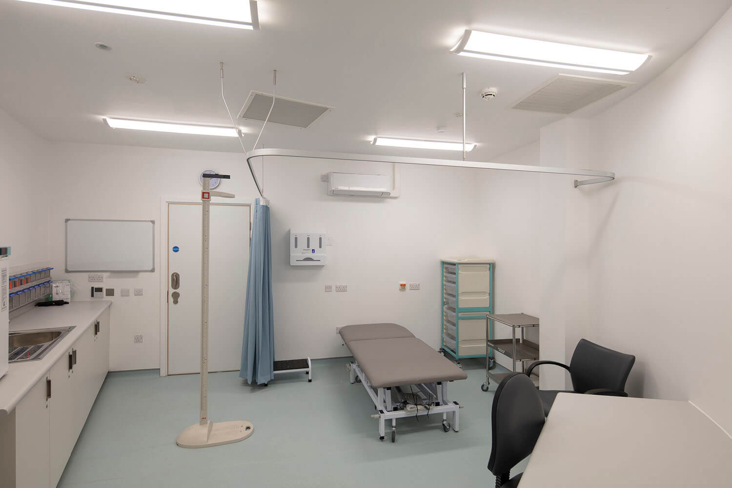 Clinical treatment room at Foss Park Hospital with examination chair and daylight
