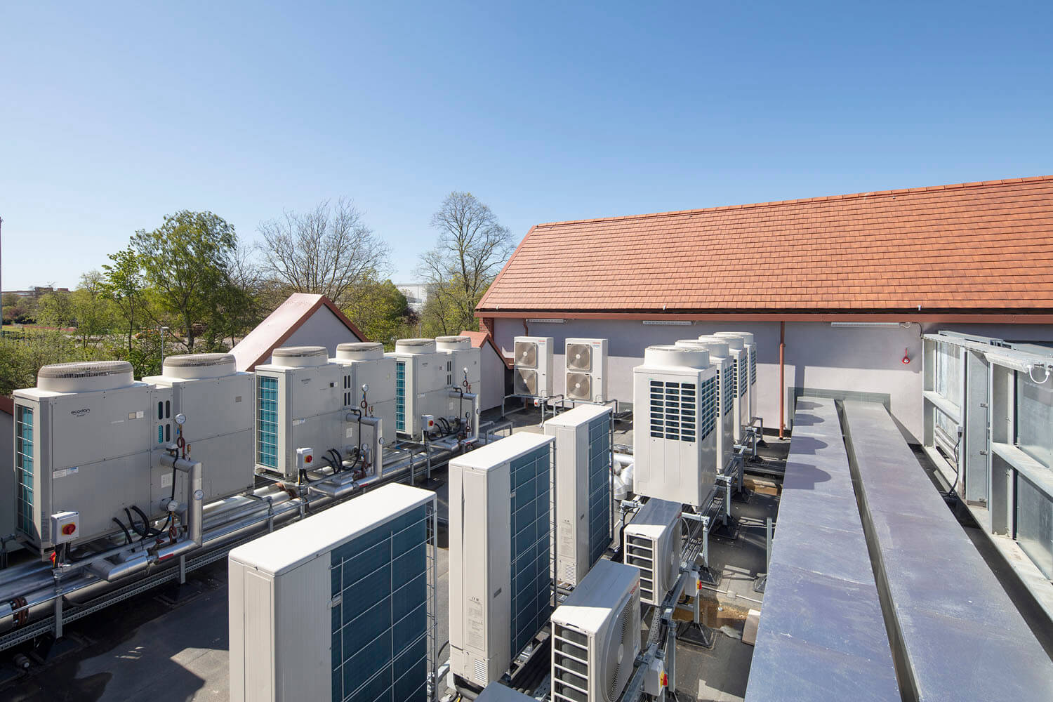 Rooftop plant and screened services along the roofline at Foss Park Hospital