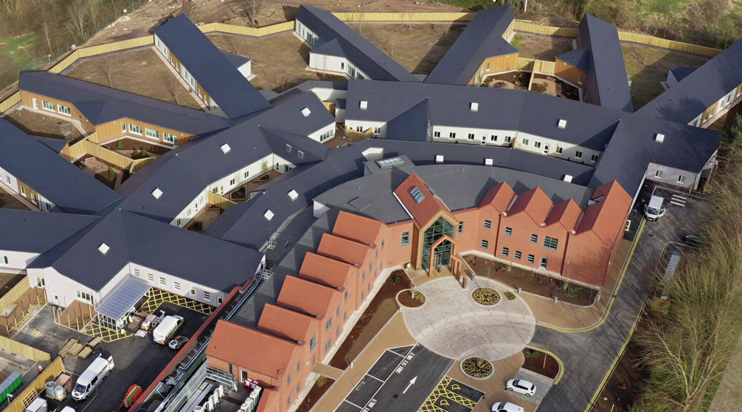 Aerial view of Foss Park Hospital's four-ward layout during construction